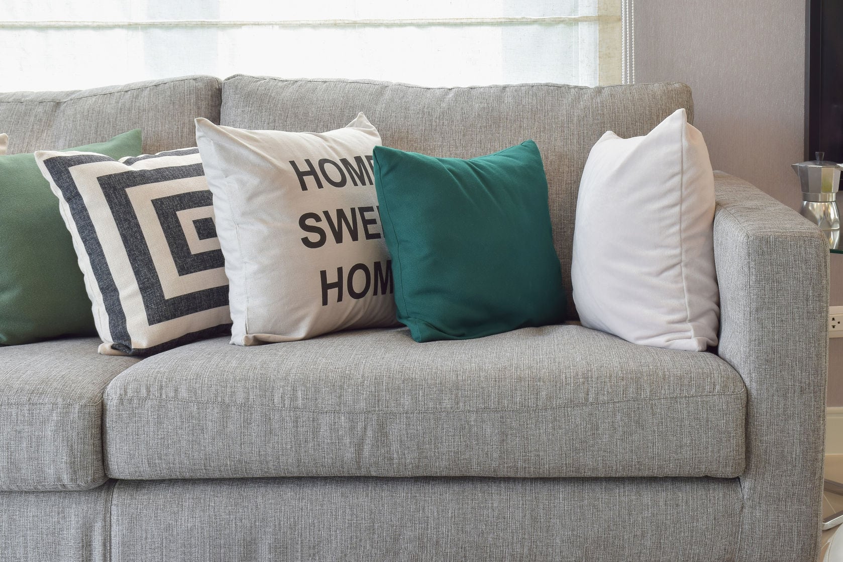 throw pillows on a gray couch