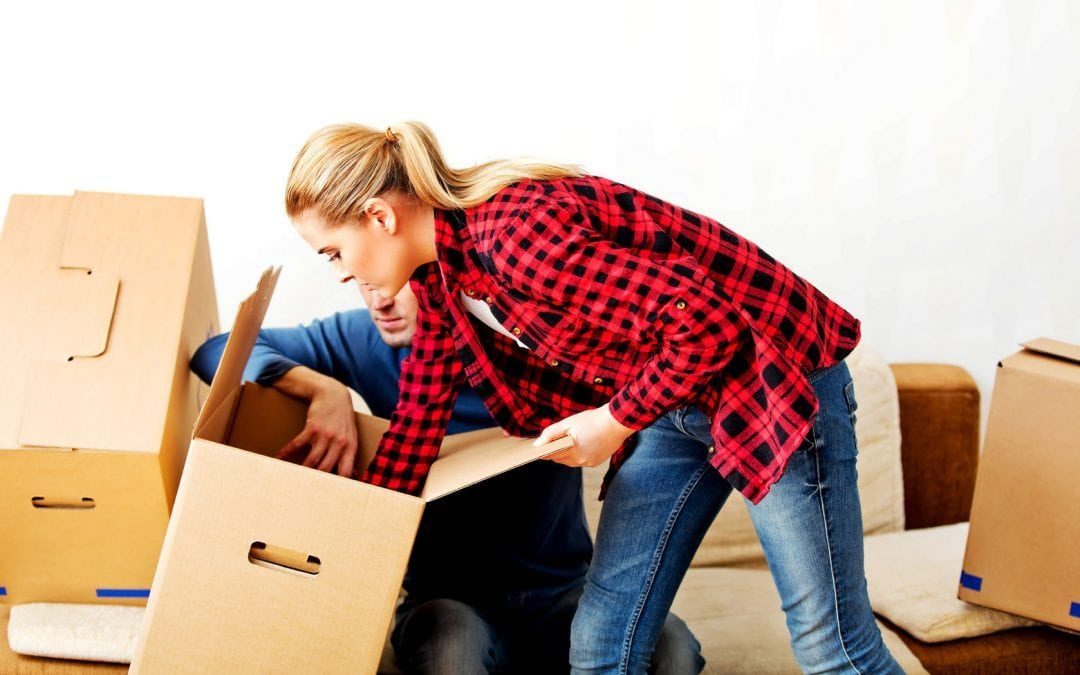 woman searching moving box