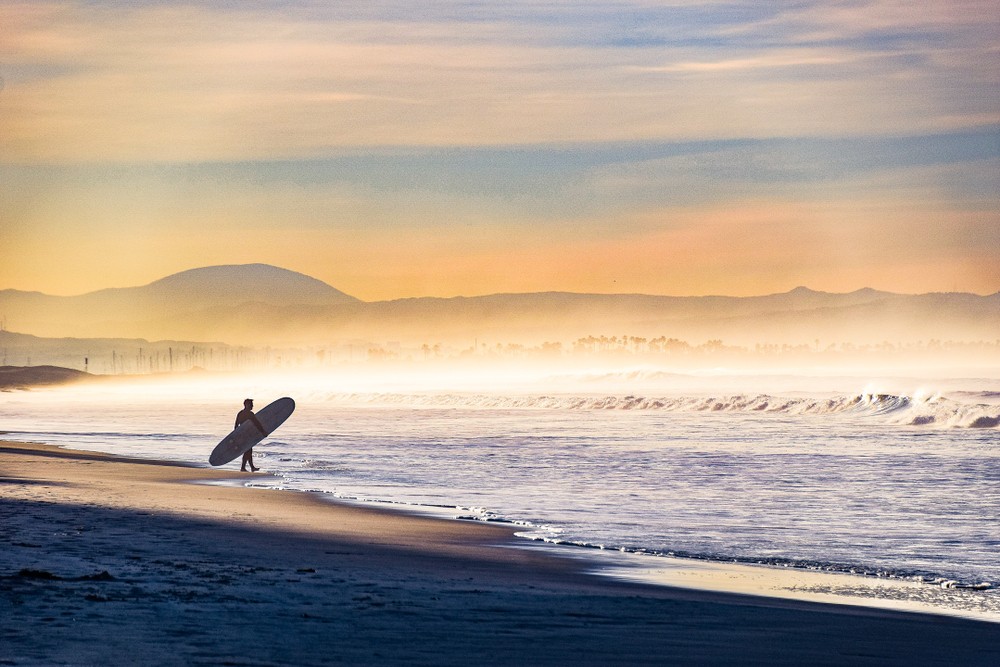 Surfer out on Coronado Beach early in the morning.