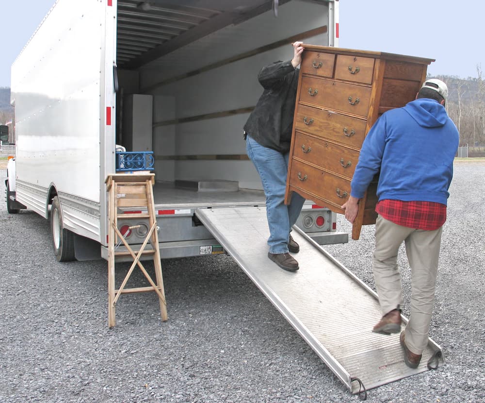 moving crew loading dresser