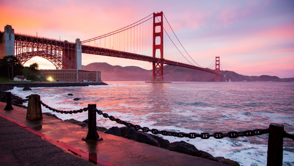 the golden gate bridge in the bay at sunset