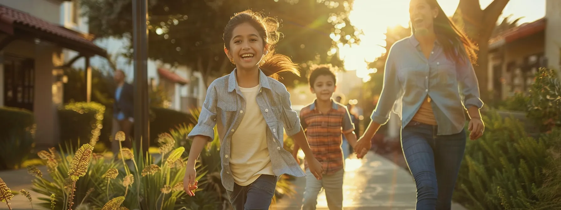 a smiling family walking hand in hand through a vibrant, family-friendly neighborhood in san diego.