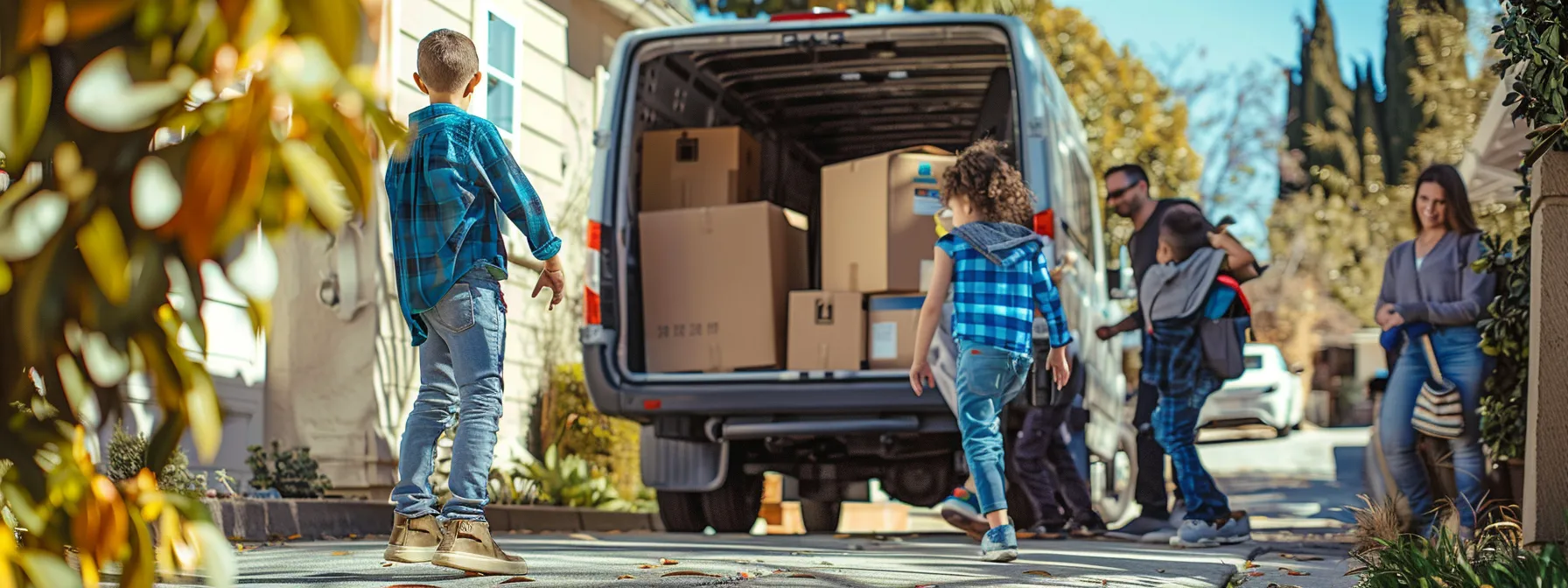 A Family Happily Watching Professional Movers Load Their Belongings Onto A Moving Truck In Los Angeles, Ensuring A Stress-Free And Successful Relocation.