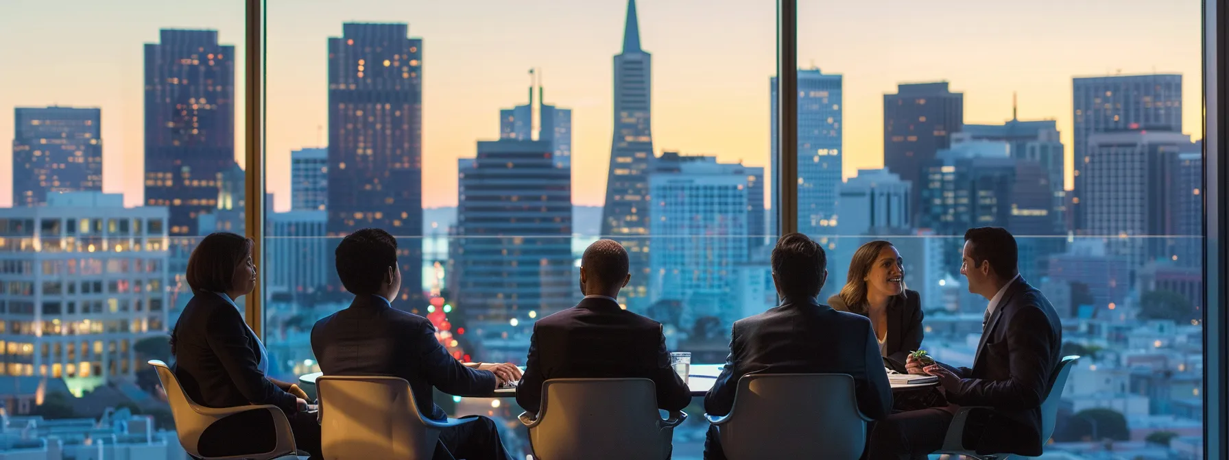 A Group Of Business Executives In Downtown San Francisco, Overlooking The City Skyline, Engaged In A Consultation With A Top Commercial Relocation Service, Carefully Discussing And Finalizing The Details For A Smooth Transition.