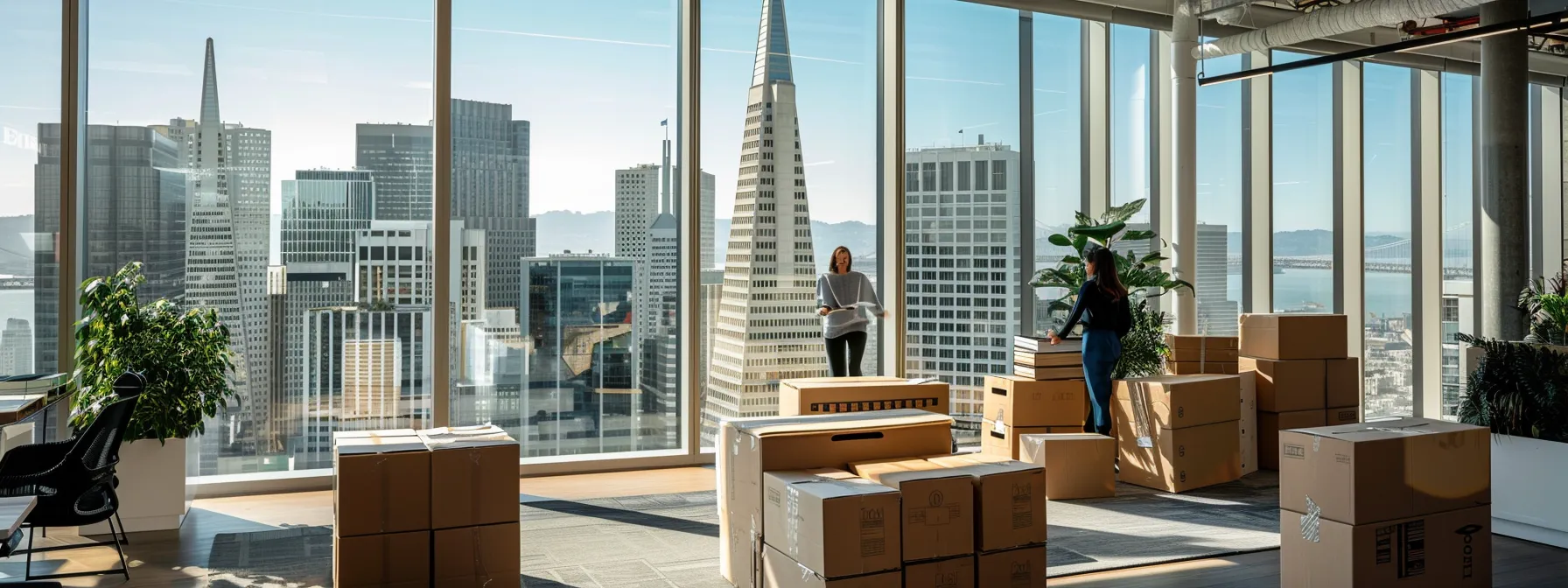 Employees Efficiently Unpacking Boxes In A Modern San Francisco Office Space Overlooking The Bustling Cityscape, With The Transamerica Pyramid In The Background.