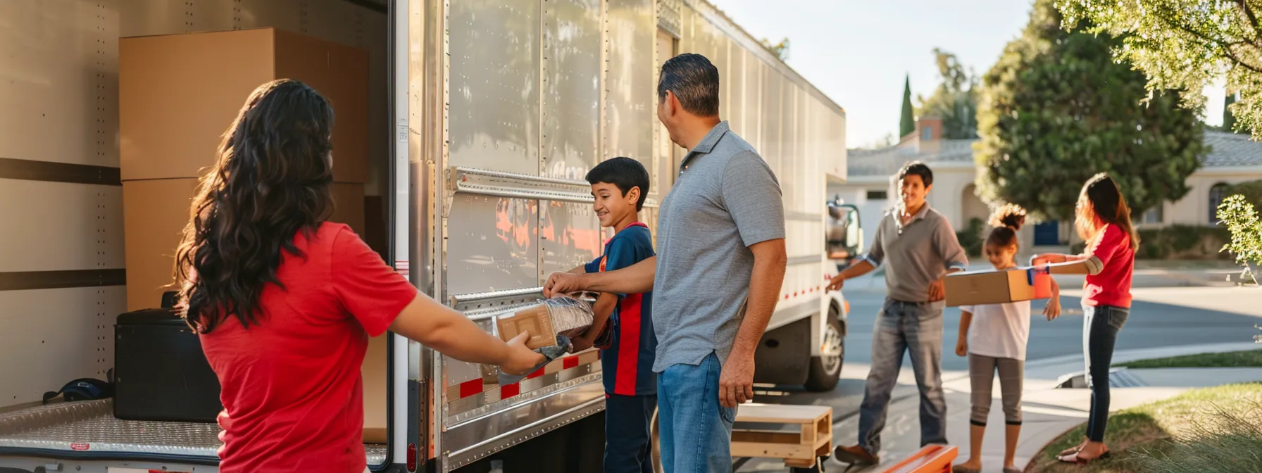 A Family Smiling As They Watch Professional Movers Efficiently Load The Moving Truck, Embodying A Stress-Free And Organized Moving Day In Los Angeles.