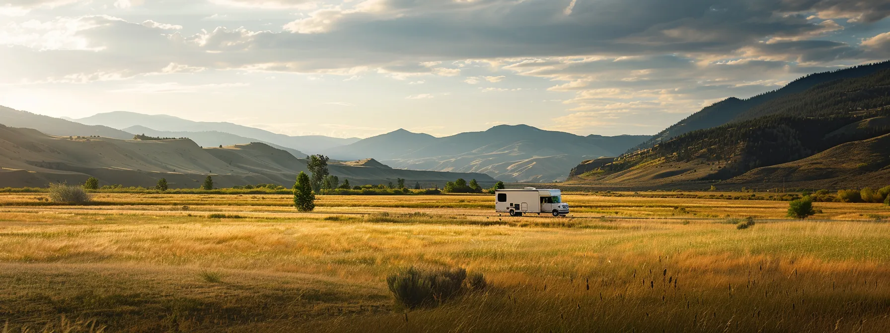 A Neatly Packed Moving Truck Driving Through A Picturesque Landscape, Symbolizing The Beginning Of A Stress-Free Cross Country Move.